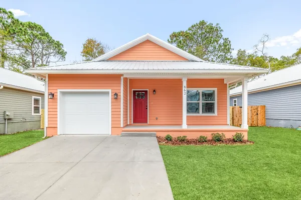 front view of a house with a yard