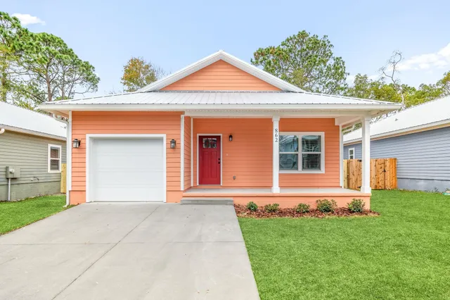 front view of a house with a yard