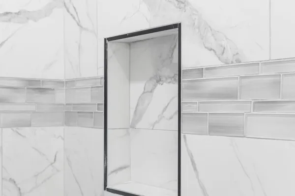 a bathroom with a glass shower door