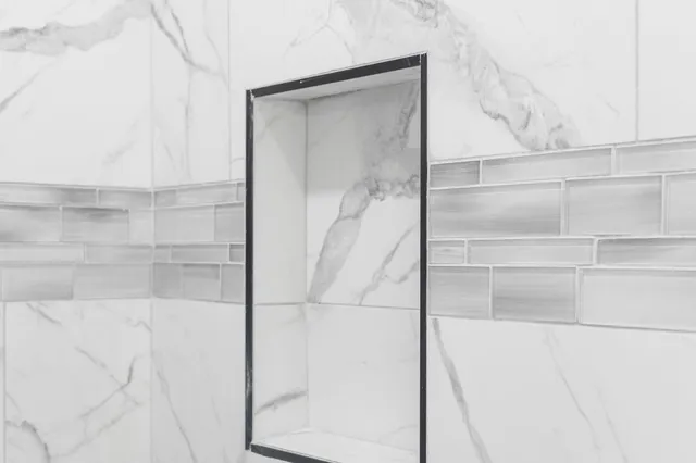 a bathroom with a glass shower door