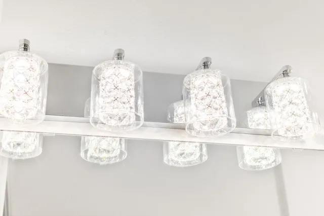 a close view of kitchen island with stainless steel appliances granite countertop