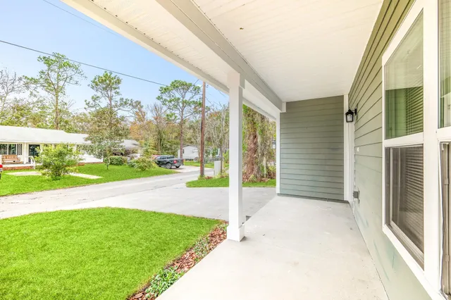 a view of a porch with a yard