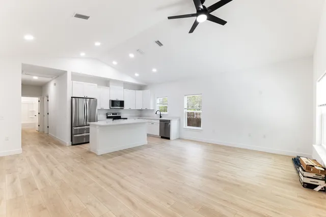 a view of kitchen with stainless steel appliances refrigerator oven and stove