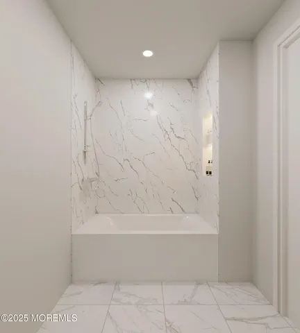 a view of bathroom and bathtub