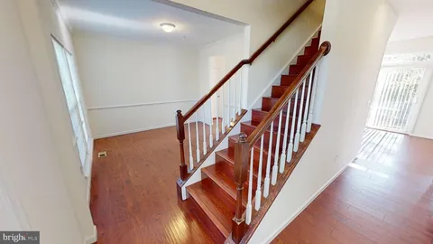 a view of an entryway with wooden floor