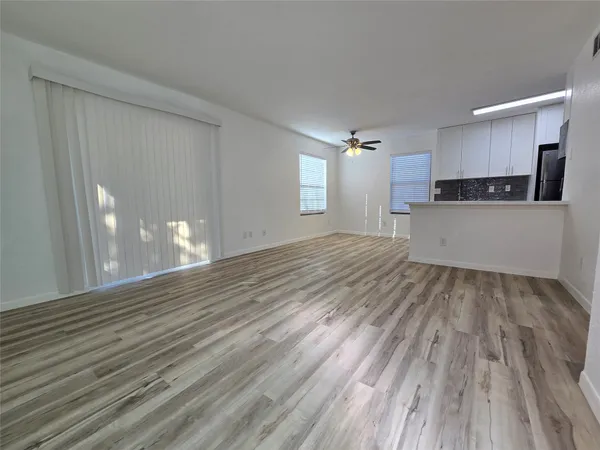 a view of a kitchen with wooden floor