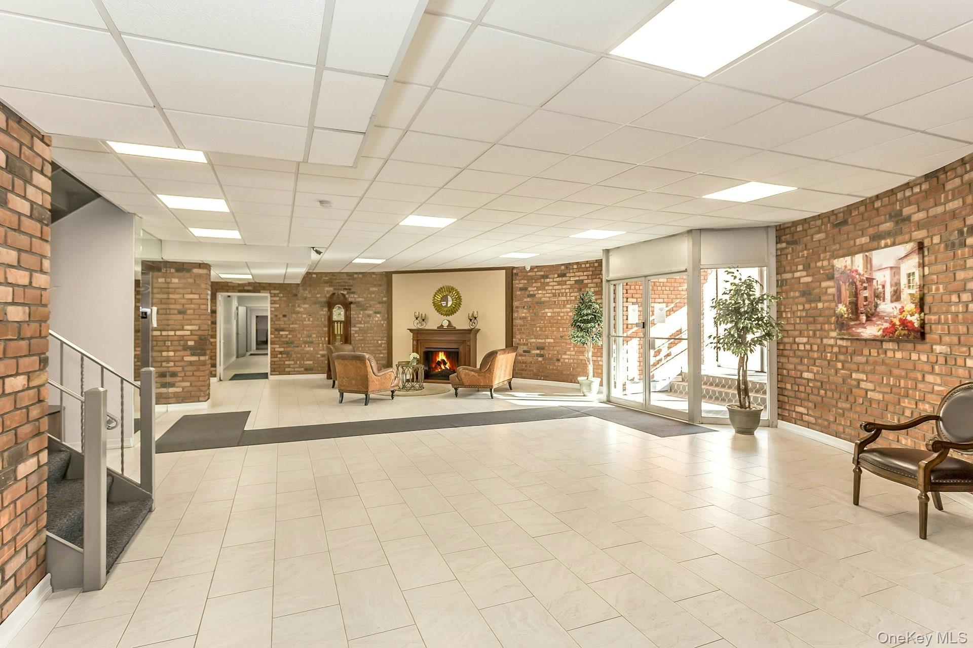 75 Noble Street, Unit 121 Lynbrook, NY 11563 - Photo 18 of 24 a room with lots of table and chairs