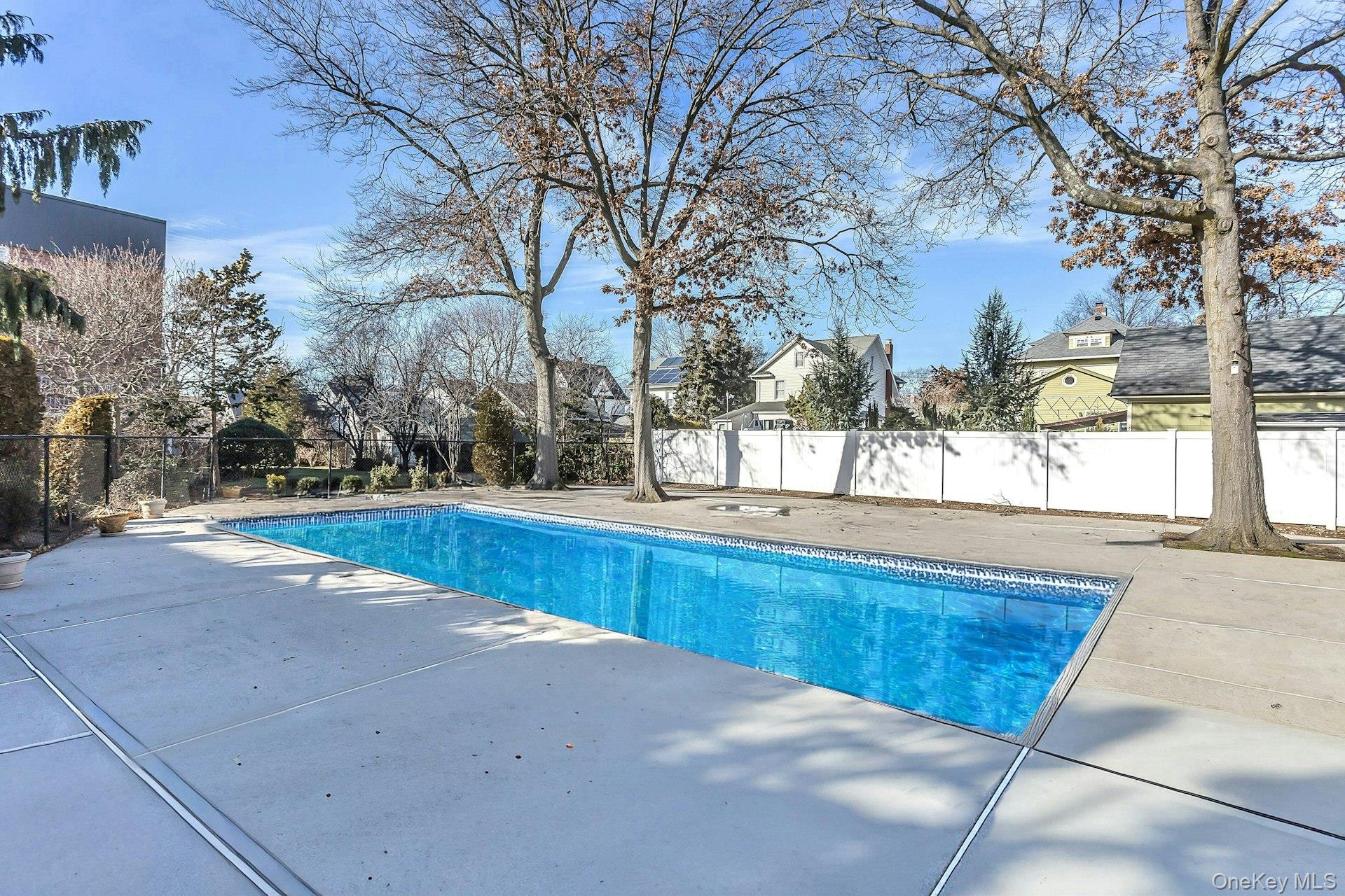 75 Noble Street, Unit 121 Lynbrook, NY 11563 - Photo 23 of 24 a view of backyard with large trees