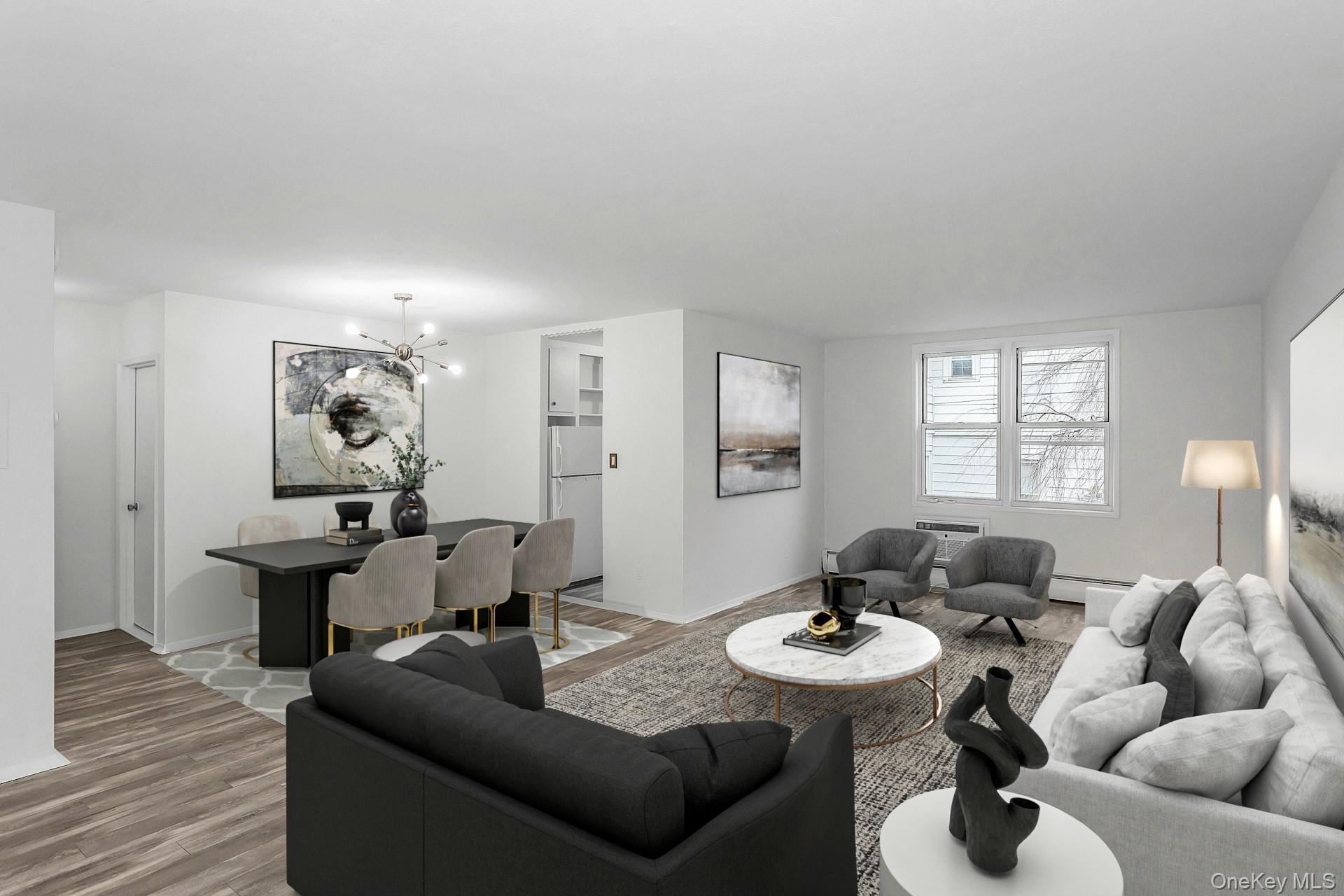 75 Noble Street, Unit 121 Lynbrook, NY 11563 - Photo 5 of 24 a living room with furniture and wooden floor