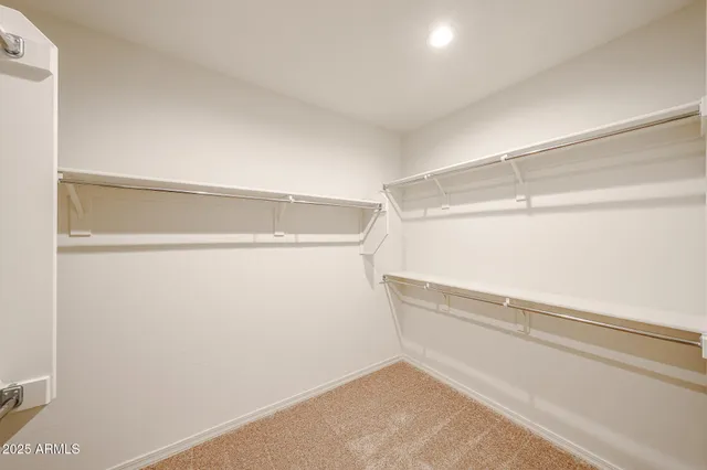 a view of an empty walk in closet