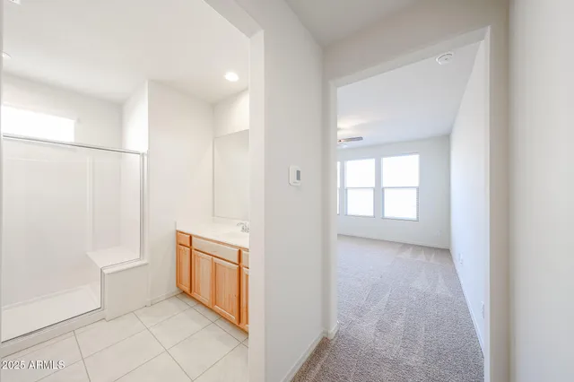 a view of a bathroom with white walls