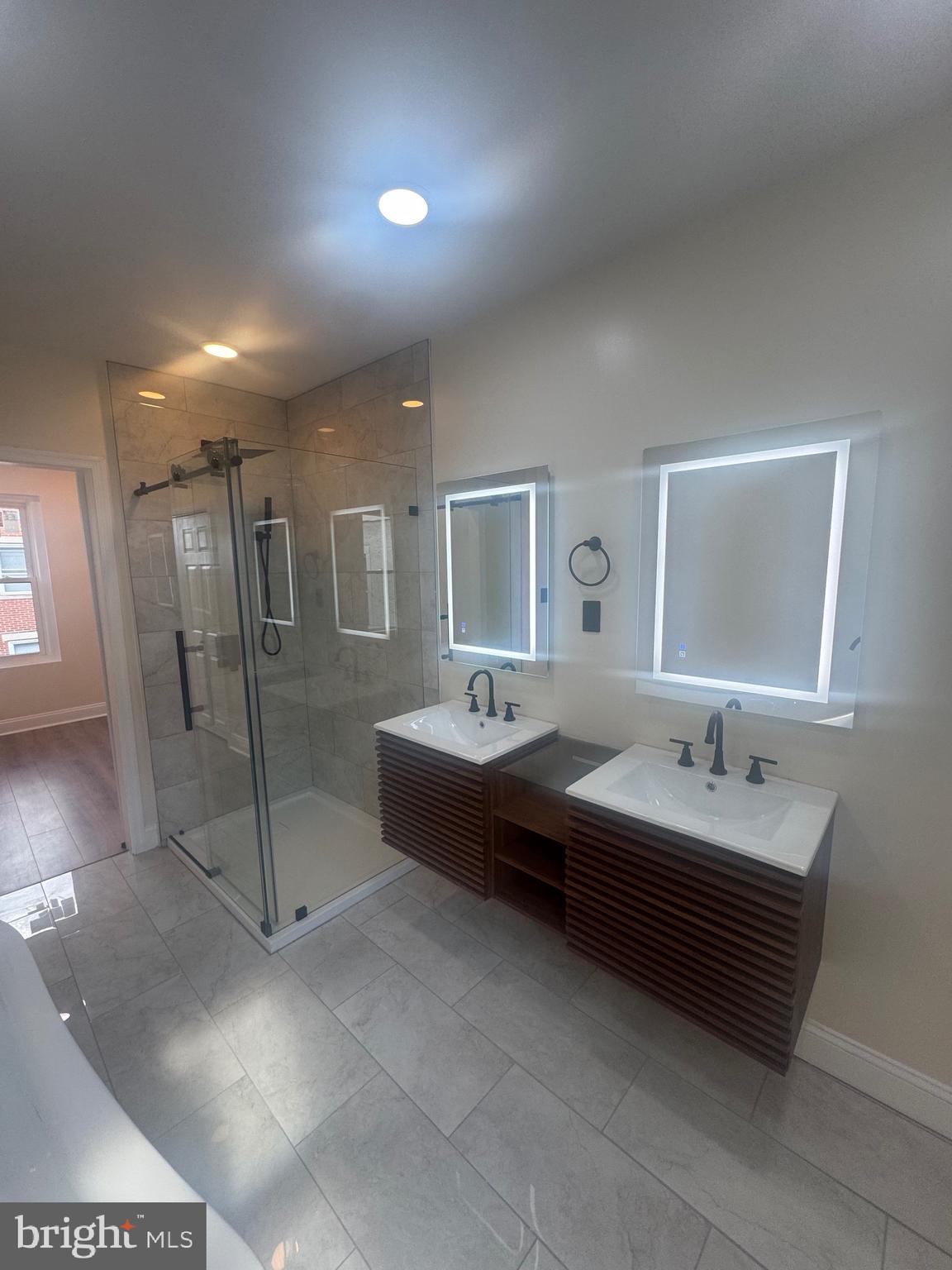 856 Perkiomen Street Philadelphia, PA 19130 - Photo 18 of 29 a spacious bathroom with a double vanity sink and a mirror
