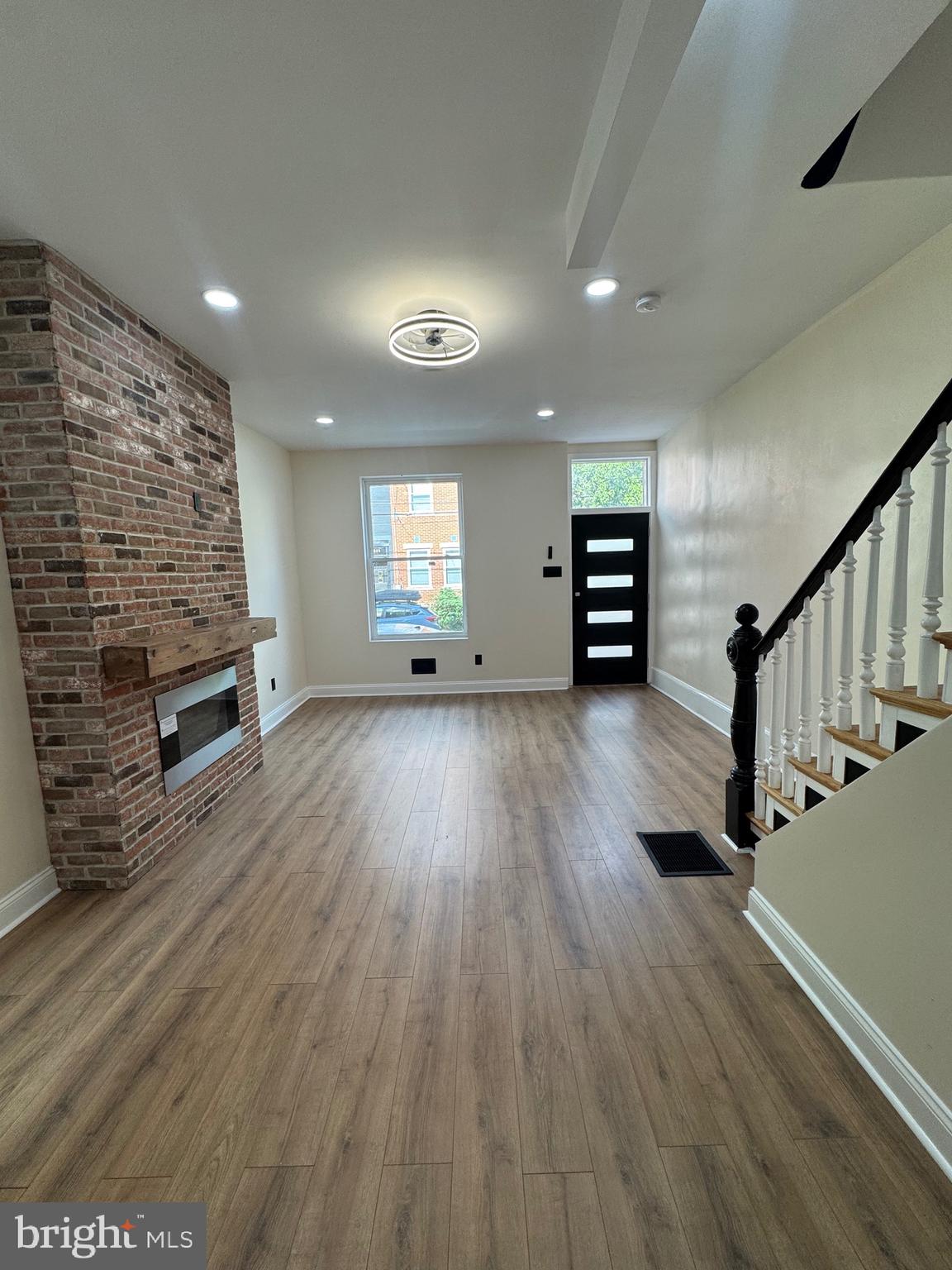 856 Perkiomen Street Philadelphia, PA 19130 - Photo 4 of 29 an empty room with wooden floor and windows