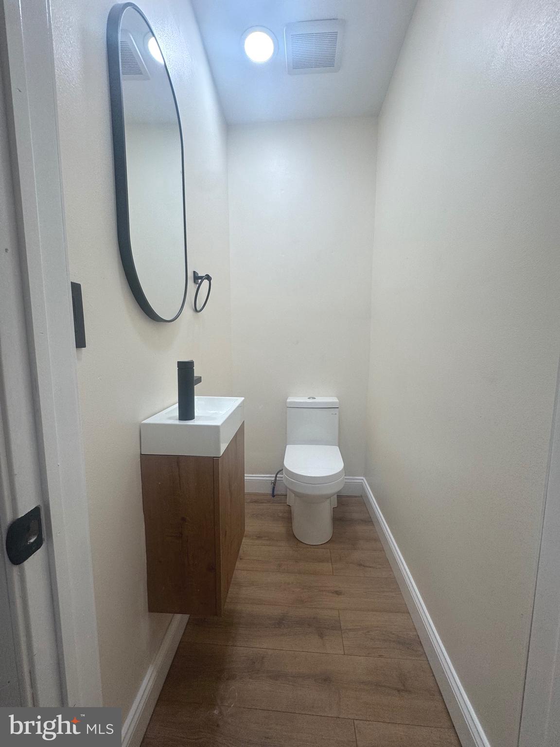 856 Perkiomen Street Philadelphia, PA 19130 - Photo 7 of 29 a bathroom with a toilet and a mirror