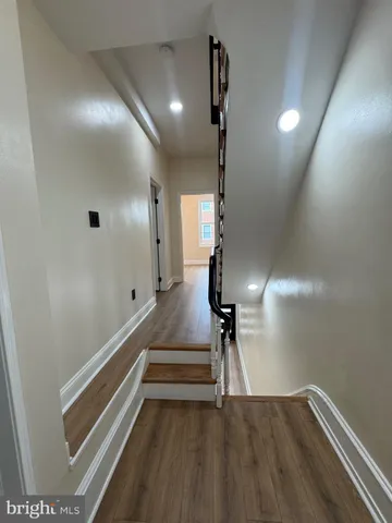 a view of entryway with wooden floor
