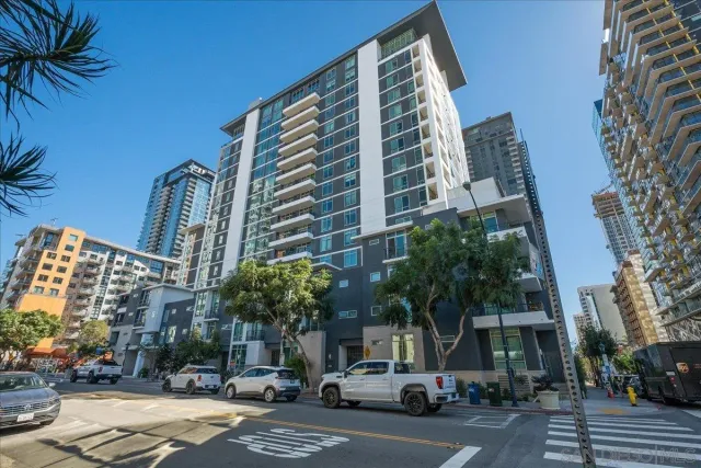 a city street lined with buildings and cars
