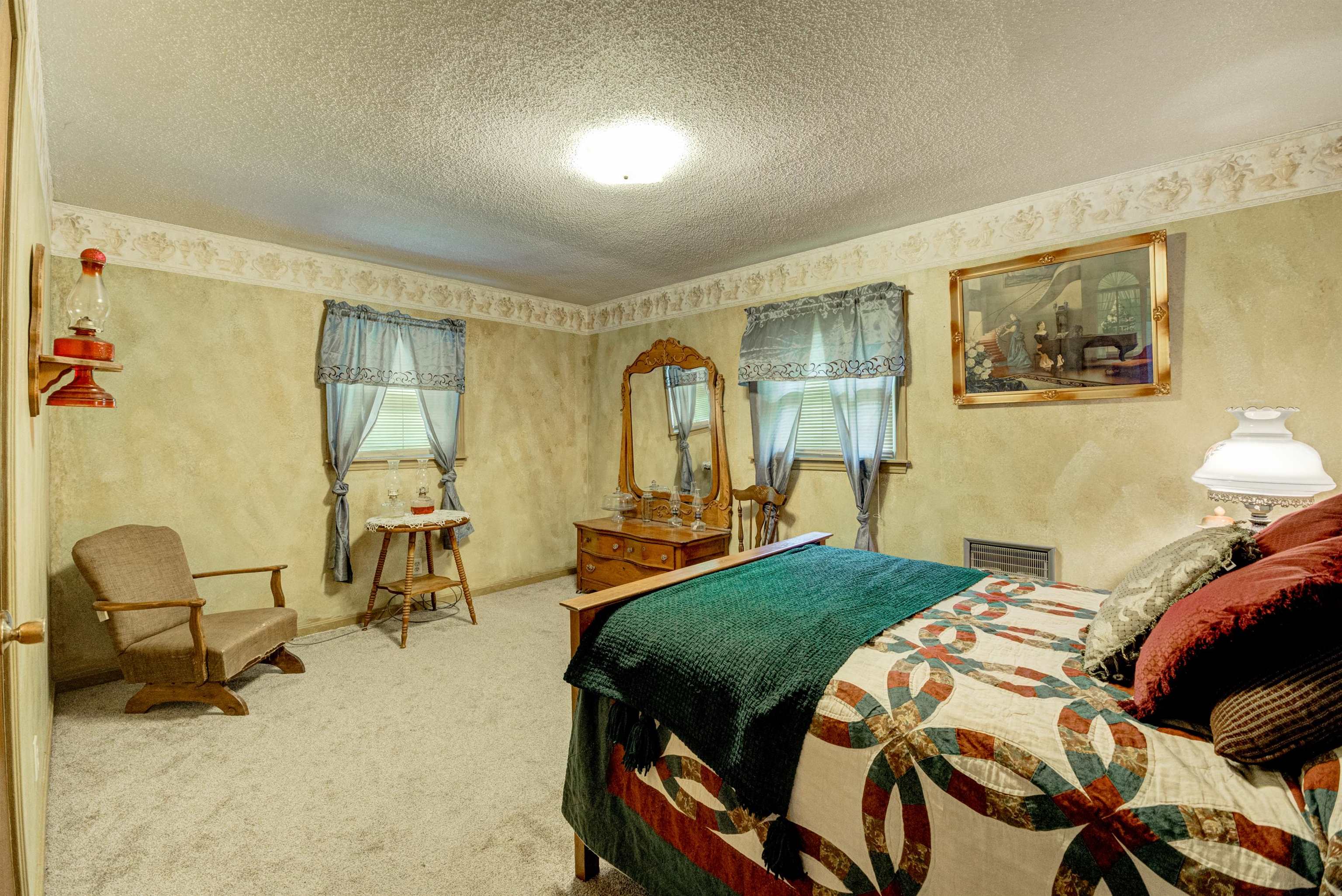105 Jody Road Medon, TN 38356 - Photo 9 of 33 a bedroom with a bed and wooden floor
