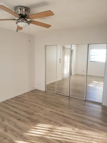 a view of a bathroom with a tub and window