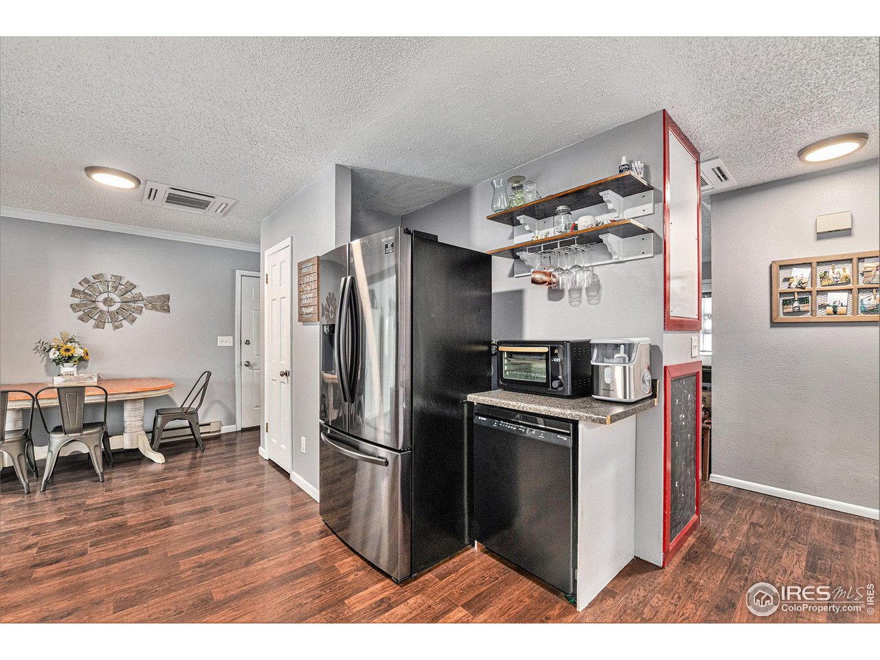 7849 First Street Wellington, CO 80549 - Photo 8 of 20 Dine-in Kitchen (water heater behind fridge)