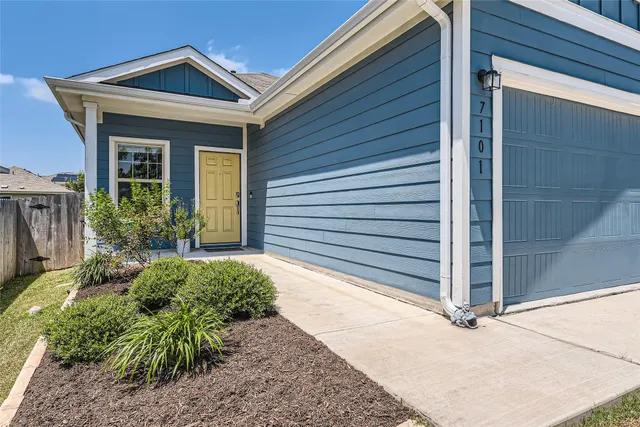 a kitchen with stainless steel appliances granite countertop a stove and a refrigerator