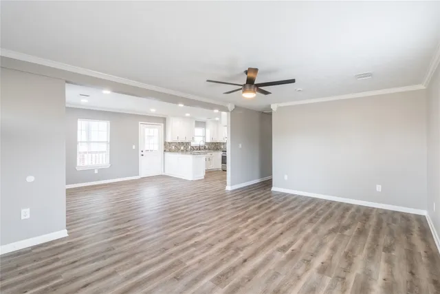 a view of a kitchen with a sink and a window