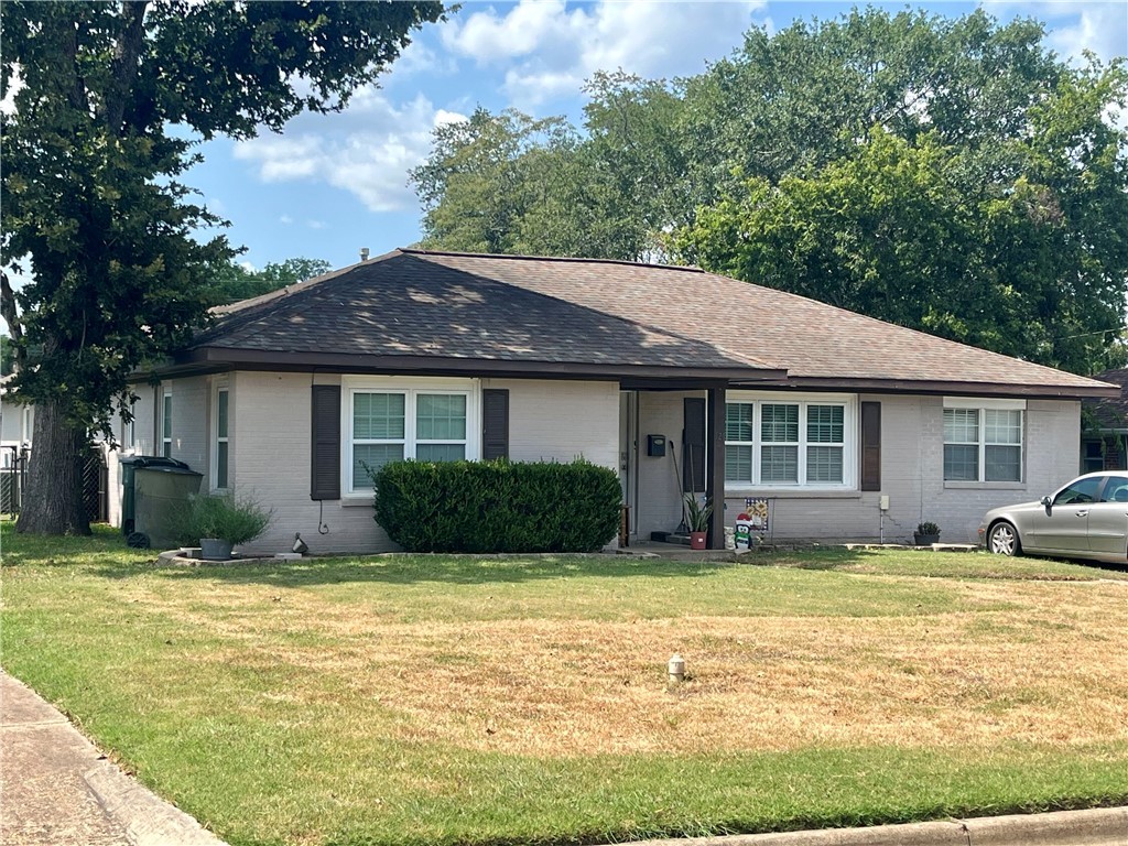 a view of a house with a swimming pool and a yard
