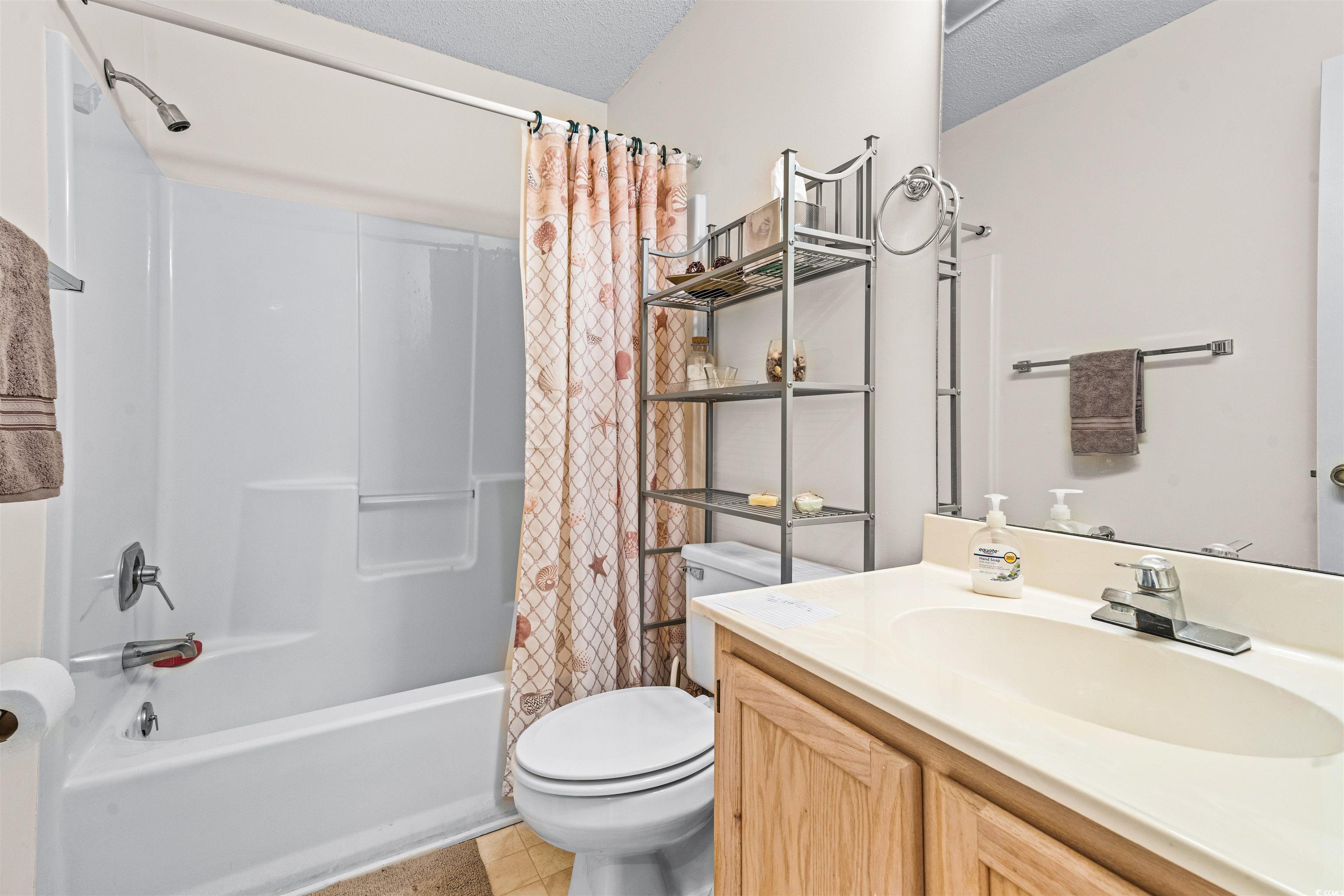 207 Landing Road, Unit F North Myrtle Beach, SC 29582 - Photo 20 of 27 Full bathroom featuring shower / tub combo, vanity