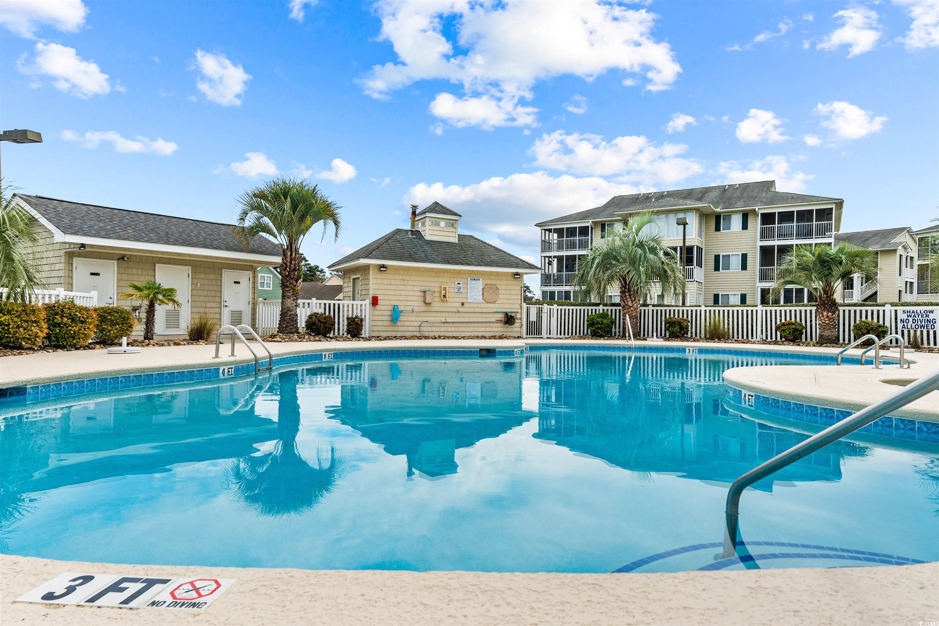 207 Landing Road, Unit F North Myrtle Beach, SC 29582 - Photo 22 of 27 View of pool with an outbuilding