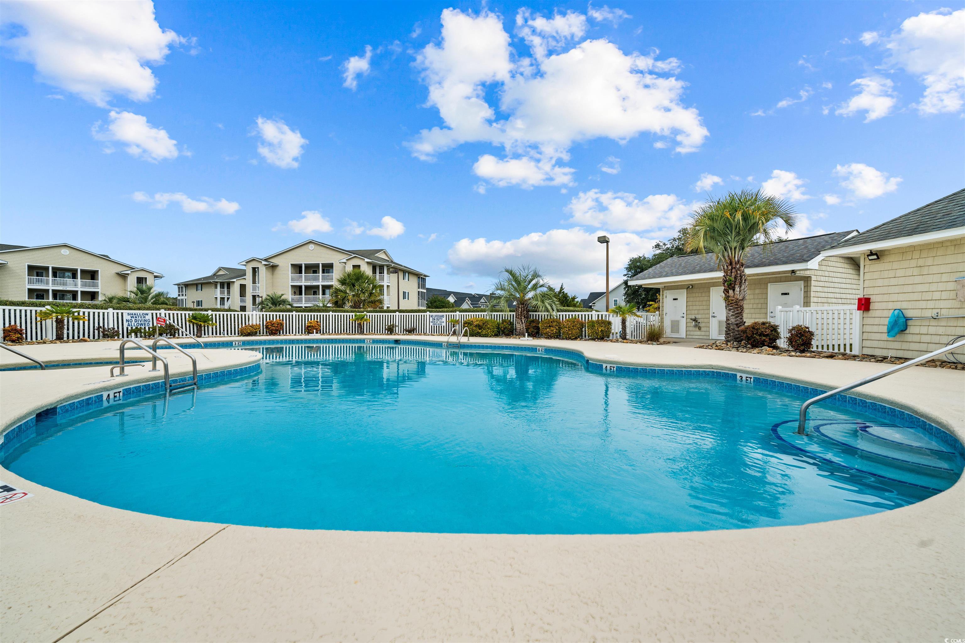 207 Landing Road, Unit F North Myrtle Beach, SC 29582 - Photo 23 of 27 View of swimming pool with a patio area