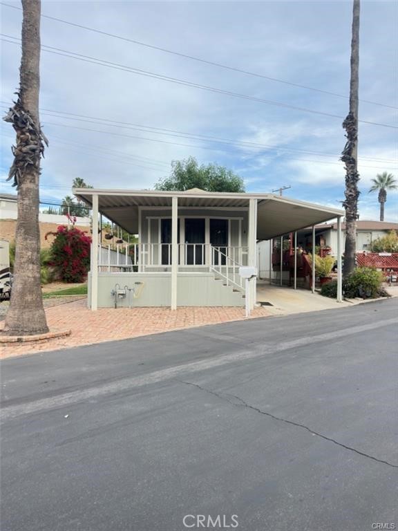 front view of a building with a garden
