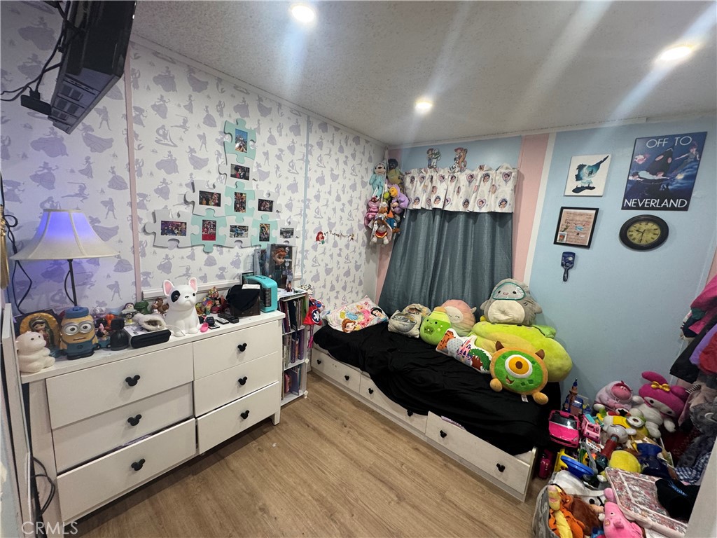 2751 Reche Canyon Road, Unit 4 Moreno Valley, CA 92555 - Photo 5 of 9 a bedroom with a bed and a dresser