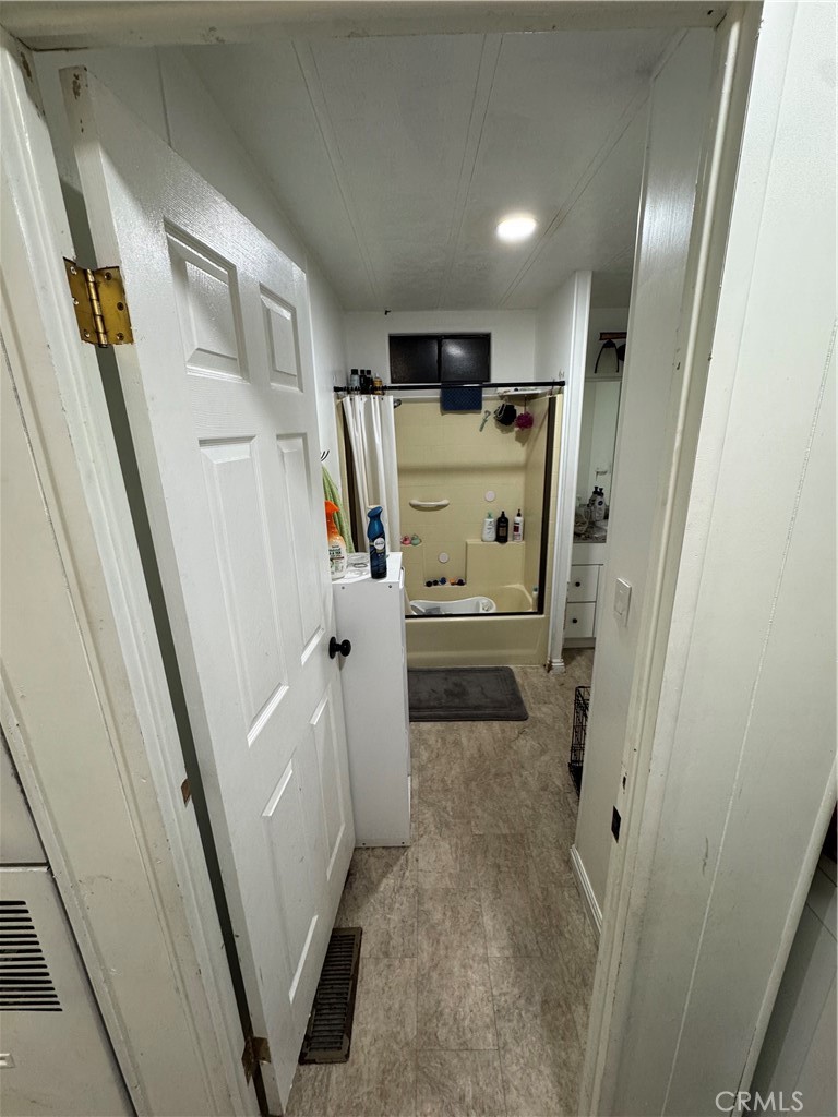 2751 Reche Canyon Road, Unit 4 Moreno Valley, CA 92555 - Photo 6 of 9 a view of a hallway with washer and dryer