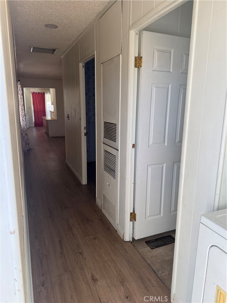 2751 Reche Canyon Road, Unit 4 Moreno Valley, CA 92555 - Photo 8 of 12 a view of a hallway with wooden floor