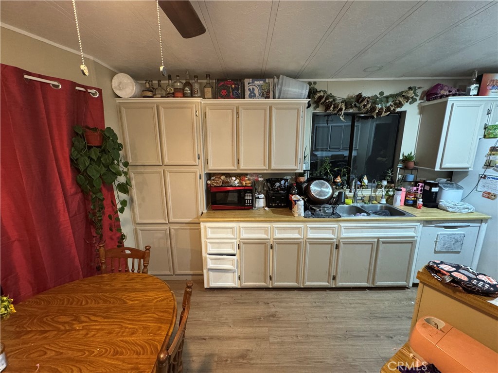 2751 Reche Canyon Road, Unit 4 Moreno Valley, CA 92555 - Photo 8 of 9 a kitchen with stainless steel appliances a sink stove and refrigerator