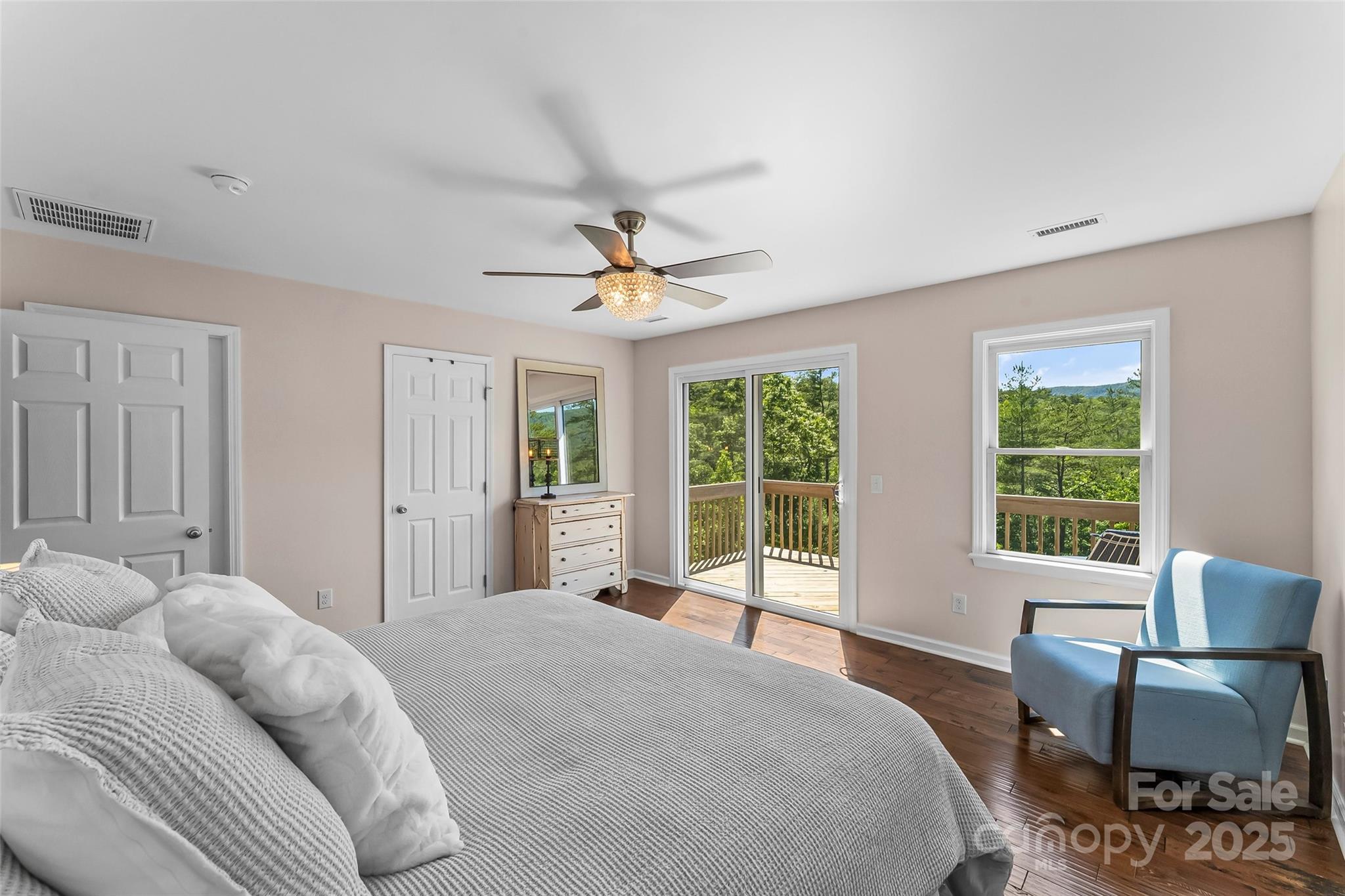 2508 Wolf Pit Road Morganton, NC 28655 - Photo 16 of 48 a bedroom with a bed and a chair with outer view