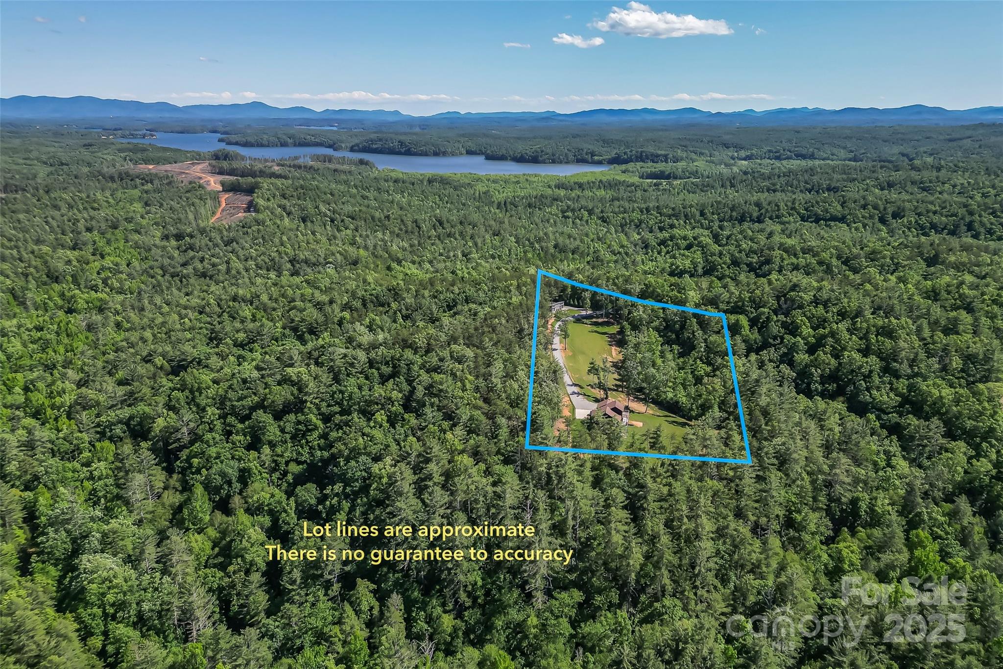 2508 Wolf Pit Road Morganton, NC 28655 - Photo 31 of 48 a view of a lush green field with lots of bushes