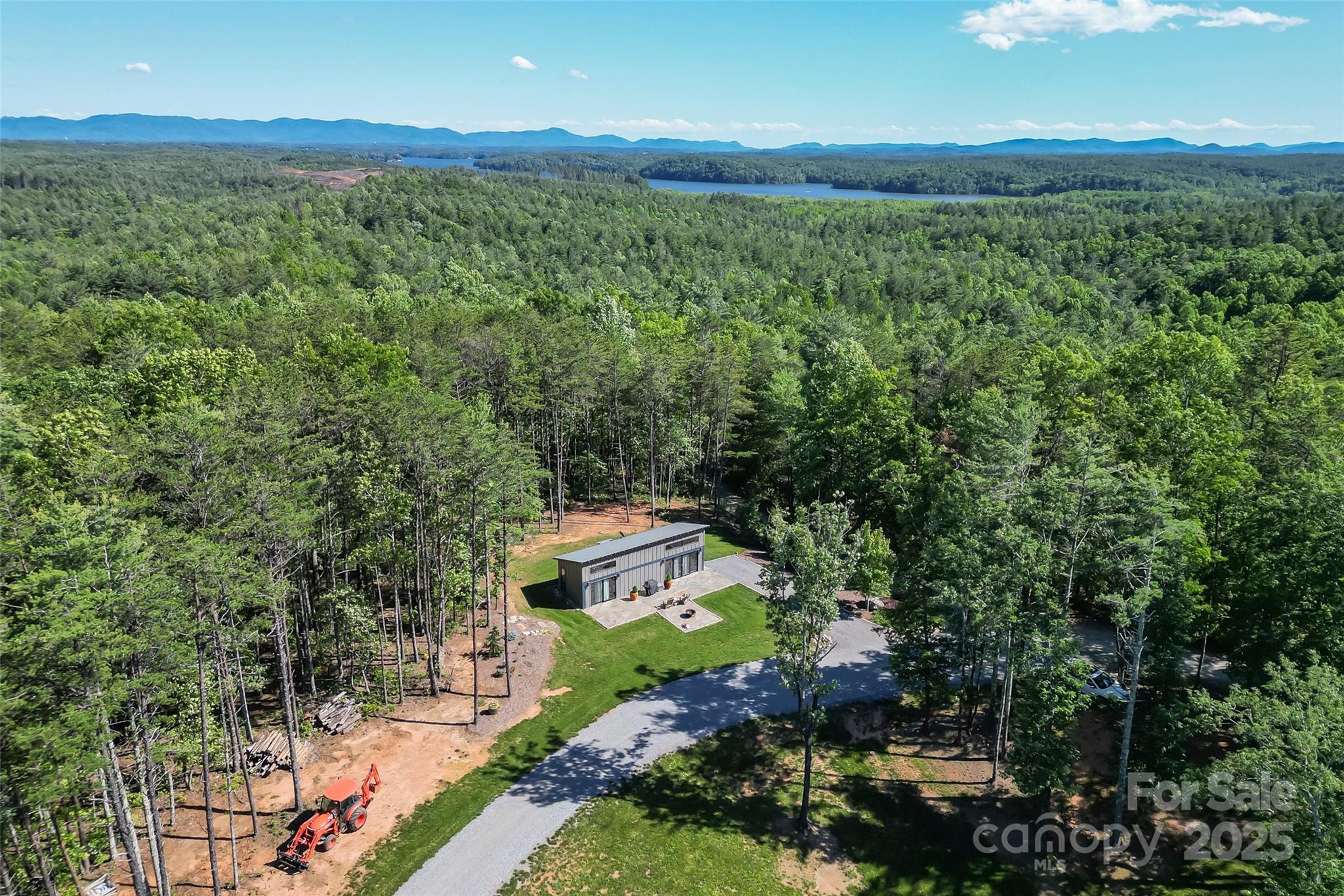 2508 Wolf Pit Road Morganton, NC 28655 - Photo 33 of 48 a view of a lush green forest with a lake