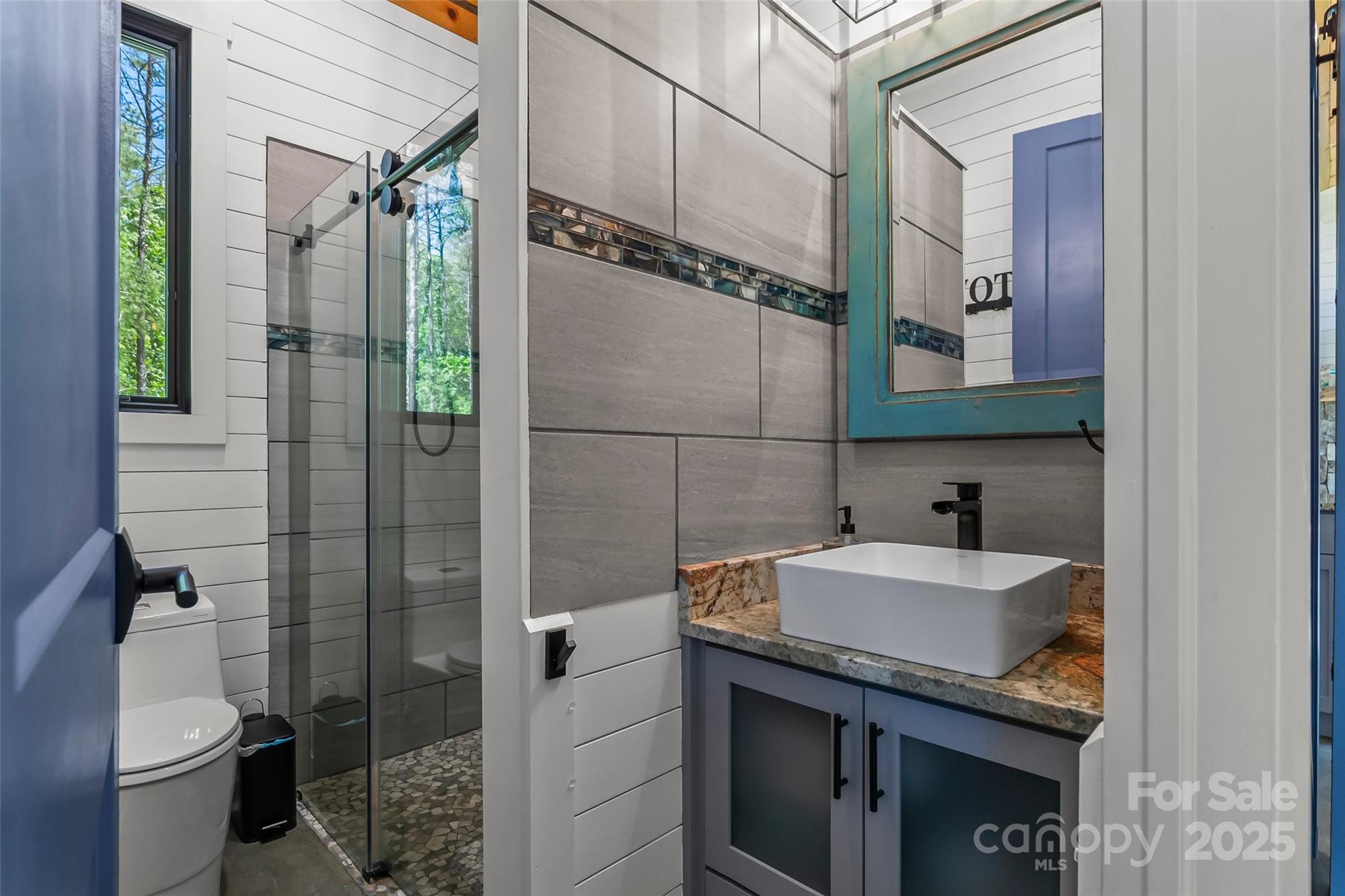 2508 Wolf Pit Road Morganton, NC 28655 - Photo 40 of 48 a bathroom with a sink a toilet and shower