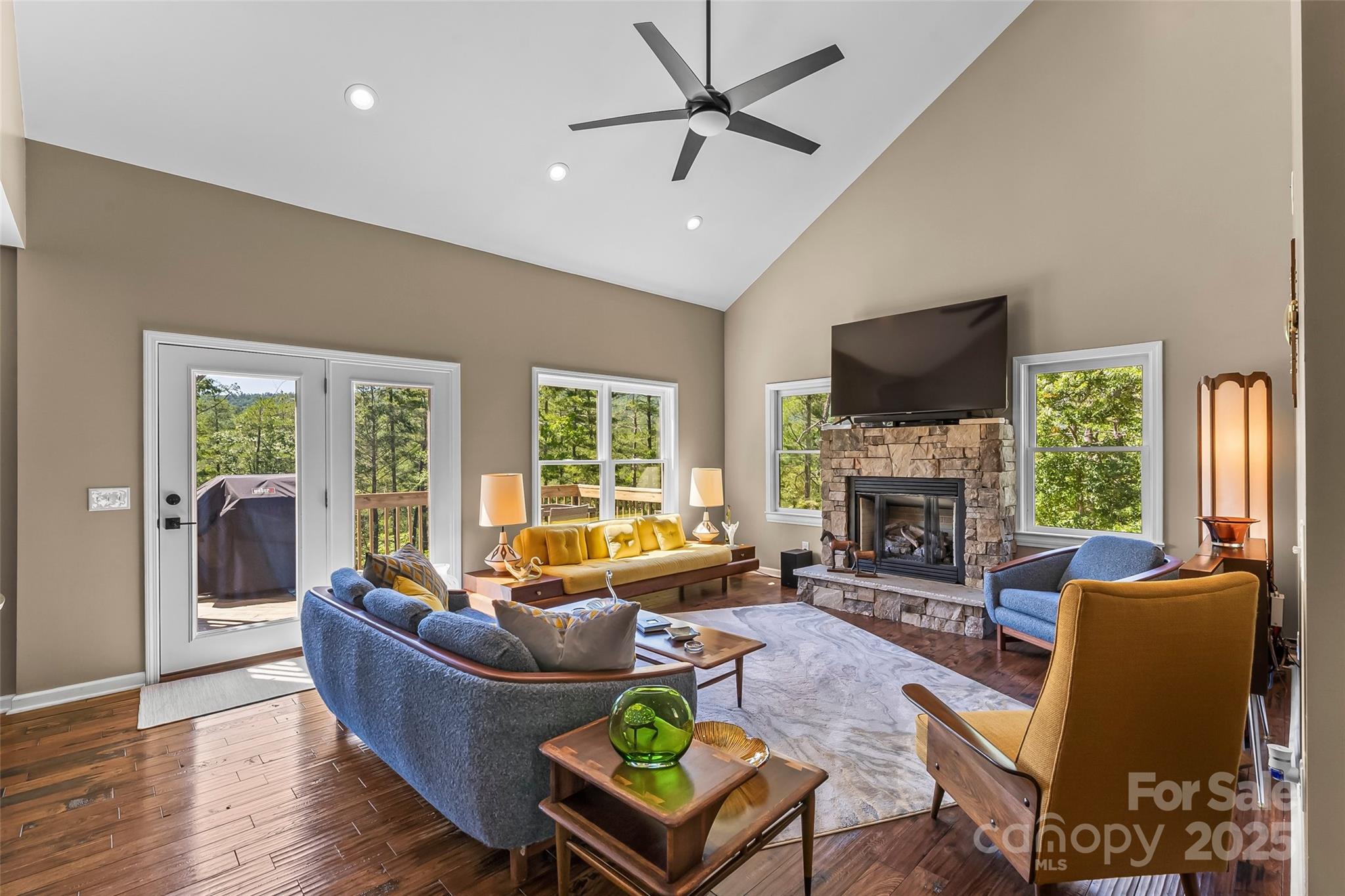 2508 Wolf Pit Road Morganton, NC 28655 - Photo 4 of 48 a living room with furniture a flat screen tv and a fireplace