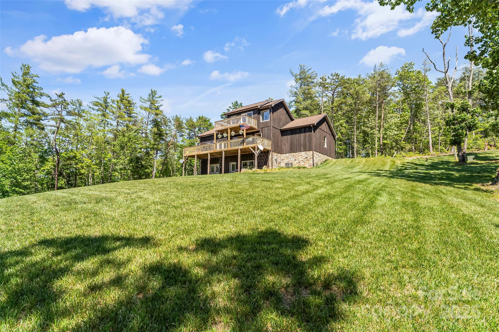 2508 Wolf Pit Road Morganton, NC 28655 - Photo 48 of 48 a backyard of a house with table and chairs