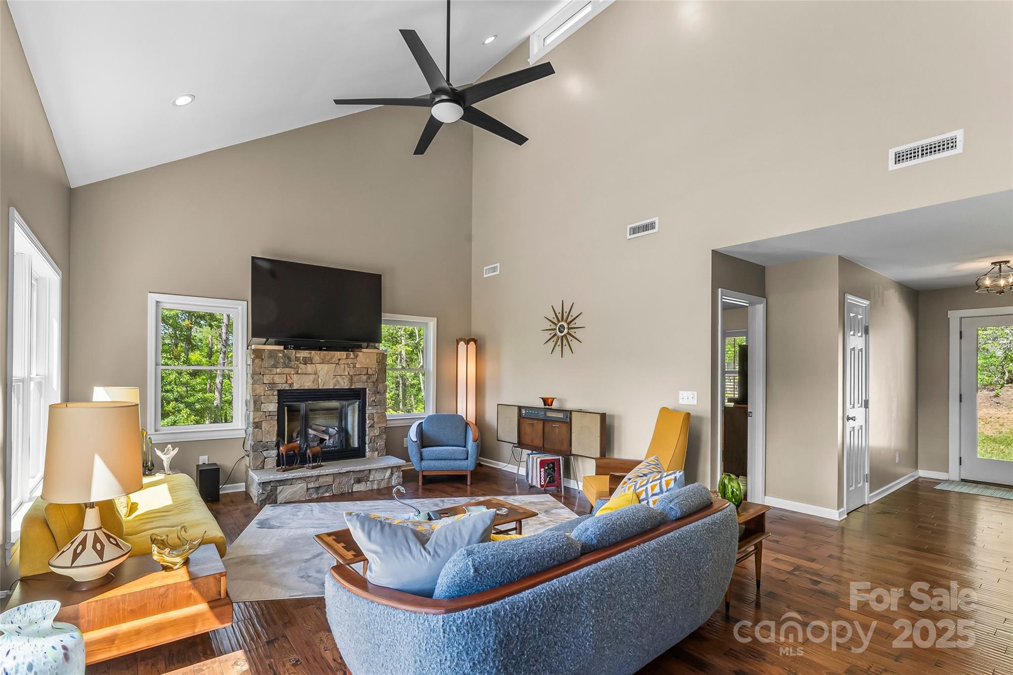 2508 Wolf Pit Road Morganton, NC 28655 - Photo 5 of 48 a living room with furniture a fireplace and a flat screen tv
