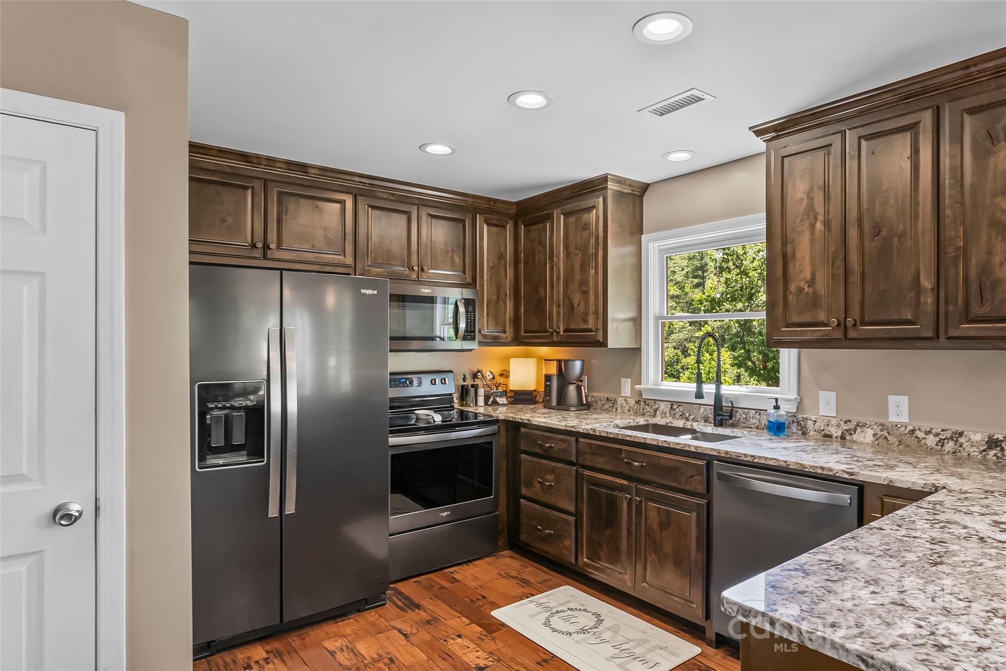 2508 Wolf Pit Road Morganton, NC 28655 - Photo 8 of 48 a kitchen with stainless steel appliances granite countertop a refrigerator sink and stove