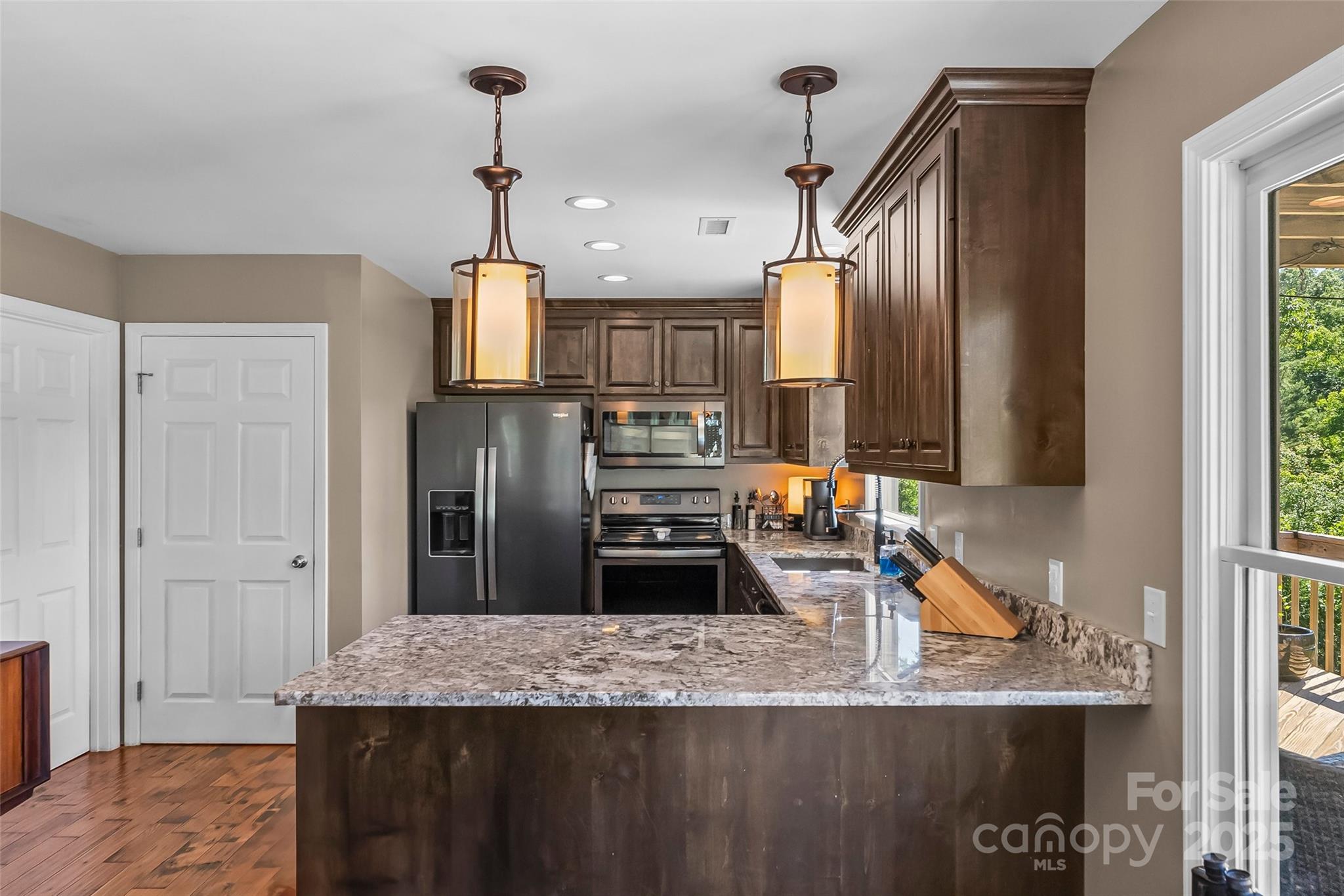 2508 Wolf Pit Road Morganton, NC 28655 - Photo 9 of 48 a kitchen with stainless steel appliances granite countertop a sink refrigerator and microwave