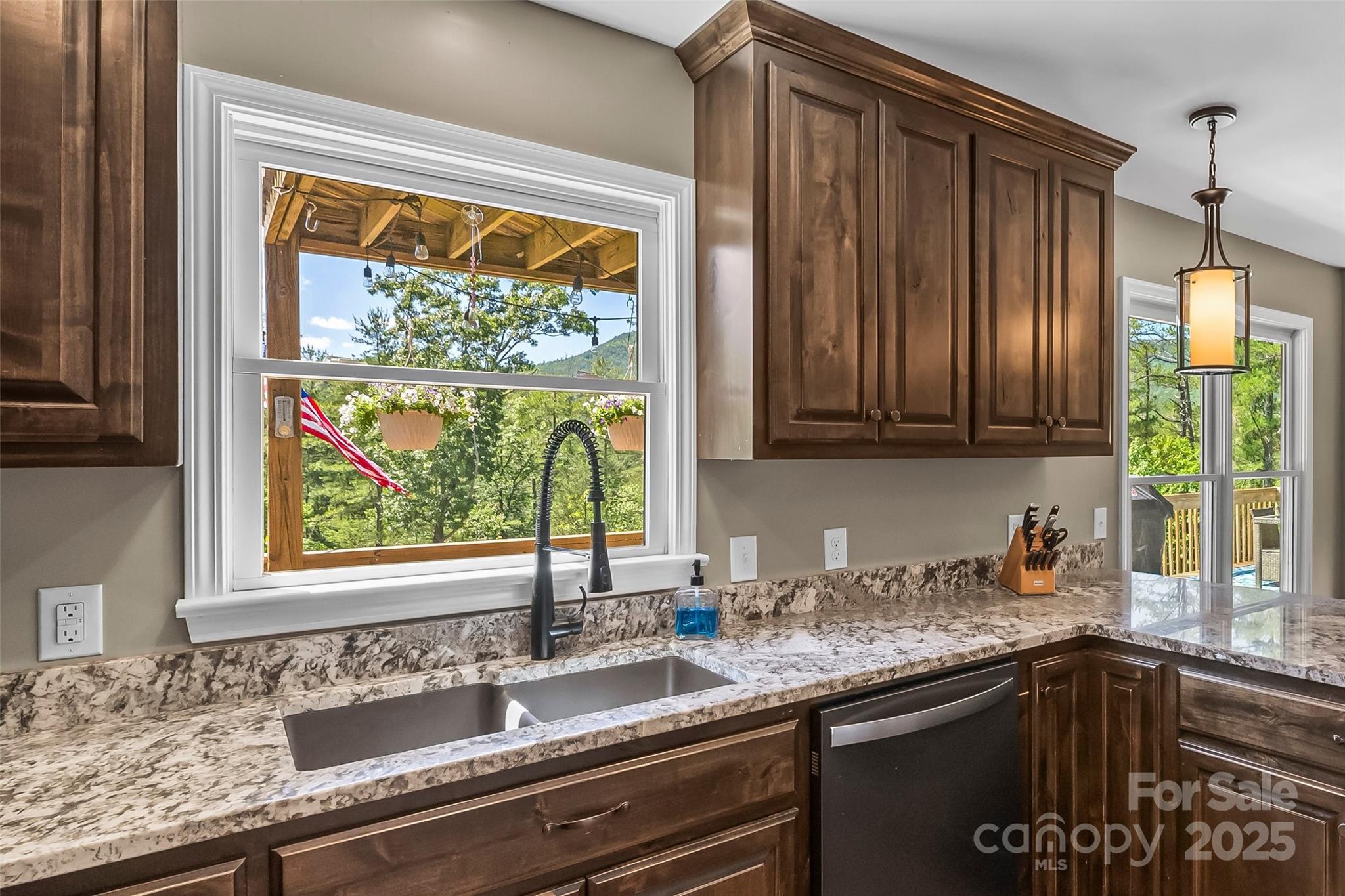 2508 Wolf Pit Road Morganton, NC 28655 - Photo 10 of 48 a kitchen with granite countertop stainless steel appliances a sink window and cabinets