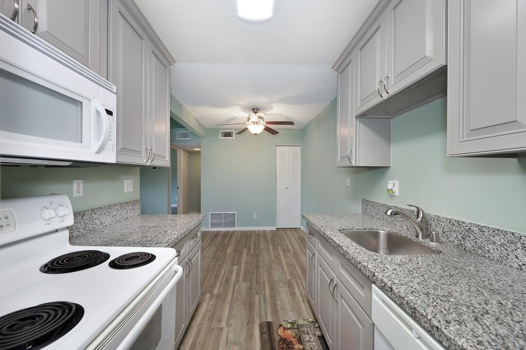 9160 Madison Avenue, Unit 68 Fair Oaks, CA 95628 - Photo 18 of 35 a kitchen with a sink and cabinets