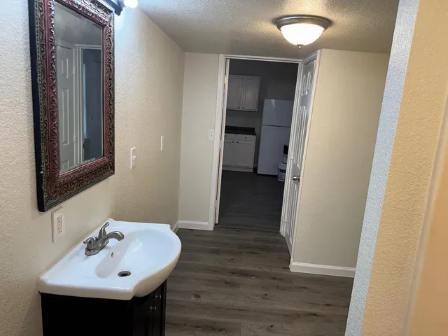 a bathroom with a sink and a mirror