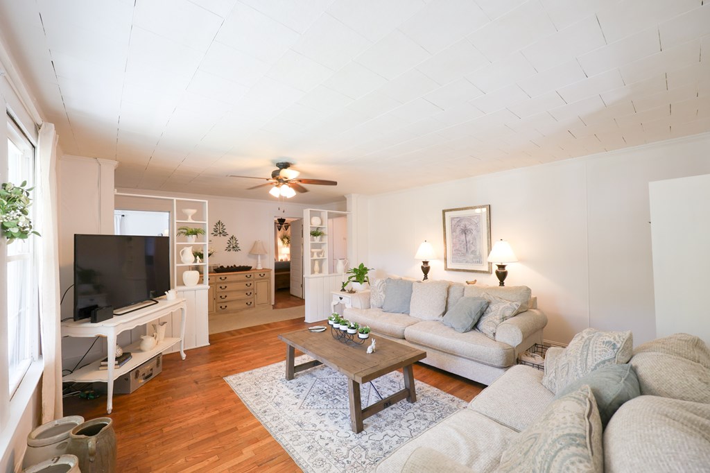 211 Williams Street Valley, AL 36854 - Photo 14 of 28 a living room with furniture and a flat screen tv