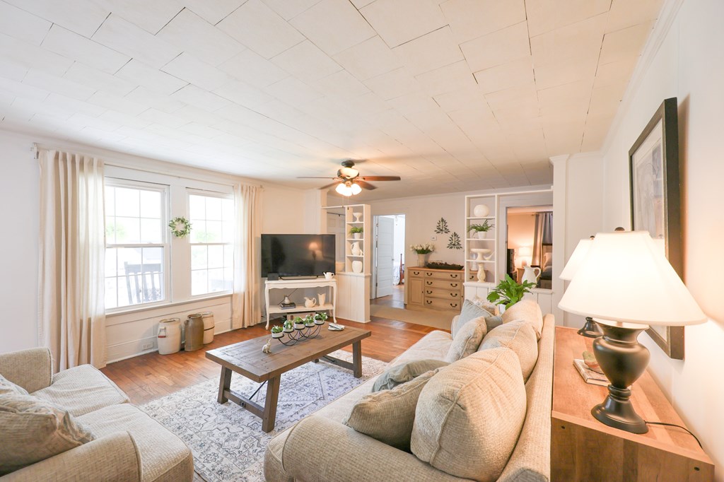 211 Williams Street Valley, AL 36854 - Photo 15 of 28 a living room with furniture a flat screen tv and a large window