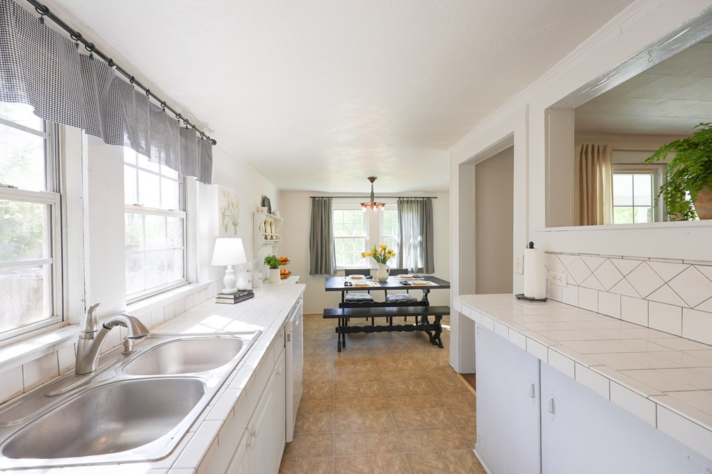 211 Williams Street Valley, AL 36854 - Photo 19 of 28 a spacious en suite bathroom with a tub double sink and mirror