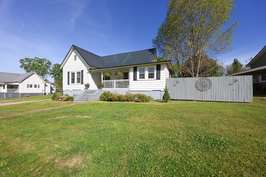 211 Williams Street Valley, AL 36854 - Photo 2 of 28 a front view of a house with garden